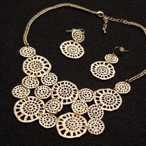 Brushed Gold Spiral Shell Bib Necklace & Earrings